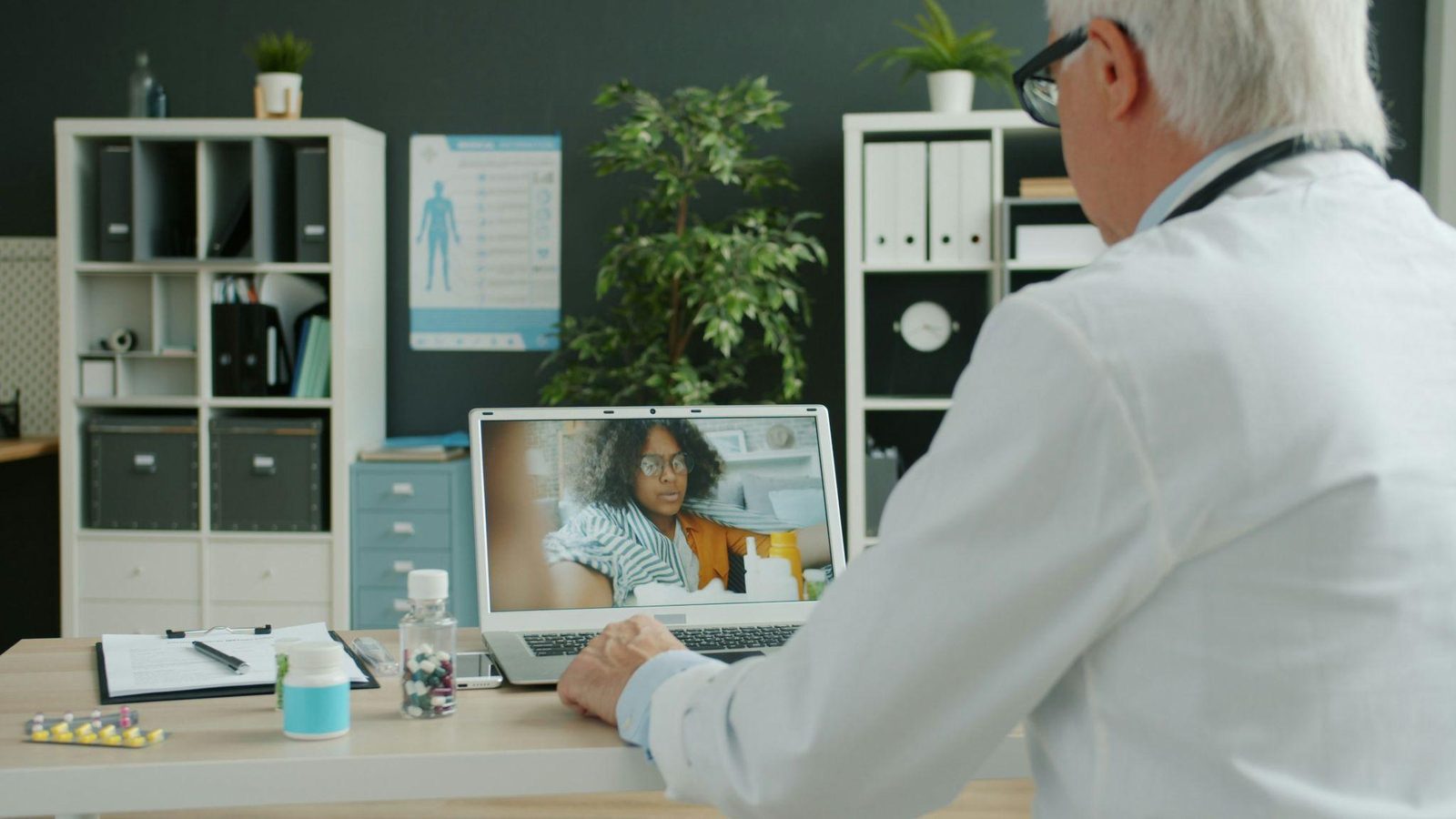 A doctor speaking with a patient over a video call